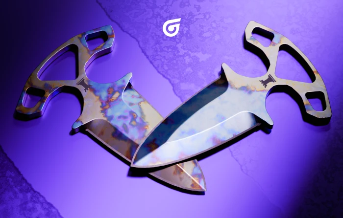 Shadow Daggers Case Hardened Blue Gem in CS2, released with the Shadow Boxing update on September 17, 2015. This Case Hardened knife pair from the Shadow Case features randomized blue, purple, and gold patterns across both blades, with high-blue pattern seeds prized by collectors seeking an affordable and distinctive Blue Gem knife set.